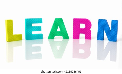 Close-up on the word learn written in different colors. Concept of learning, study and assimilation. Try to learn concept. Learning by making mistakes. Learning while having fun. 