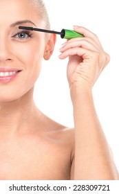 Closeup On Young Girl Mascaras Her Eyelashes In Bathroom. Beauty Makeup Woman Putting Mascara Eye Make Up On Eyes.