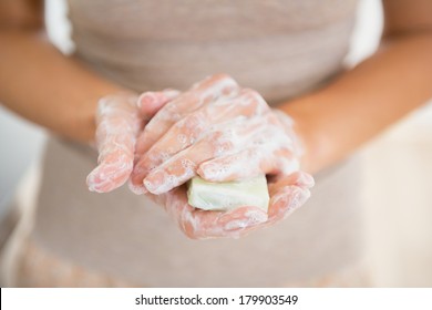 Closeup On Young Woman Hands With Soap Bar