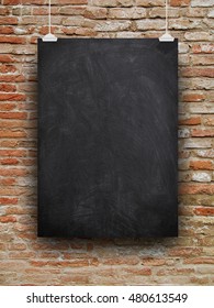 Close-up of one blank blackboard frame hanged by clips against old weathered orange brick wall background - Shutterstock ID 480613549