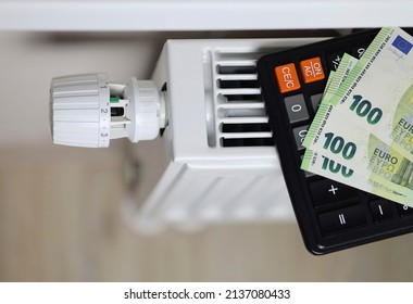 A Close-up Of One Hundred Euro Bills Lie On A White Central Heating Battery. The Concept Of High Heat Payments In Europe. Crisis, Increase Of Bills For Payment, Winter Period