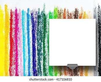 Close-up of one square blank frame supported by clip against multicolored chalk background