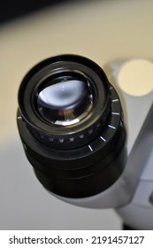 Close-up Of One Of The Two Lenses On An Ophthalmic Surgical Microscope Used To Get Better Visualization Of The Eye During Retina, Cataract, Glaucoma And Corneal Surgeries.