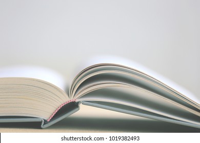 Close-up of open book on the floor selective focus and shallow depth of field - Powered by Shutterstock