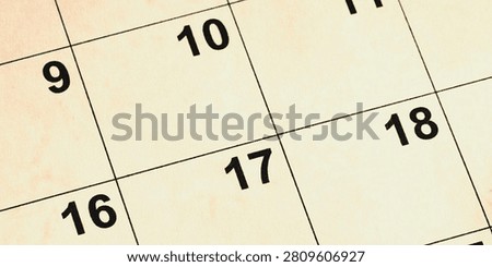 Close-up of open calendar grid with dates, perfect for business planning, time management, and schedule tracking.