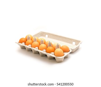 Close-up an open carton box of a dozen fresh cage free grade A large brown eggs isolated on white background. Top view dozen eggs in cardboard container, paper egg box with clipping path, copy space. - Powered by Shutterstock