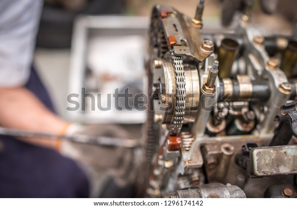 Close-up of an\
open engine block and crankshaft on a table in service garage.\
Automotive part,machine part\
.