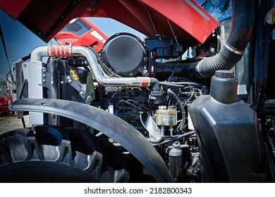 Closeup of the open engine of a small modern tractor. Fuel and electrical control systems. - Shutterstock ID 2182800343