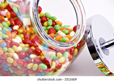 Close-up Of Open Jar Of Colorful Jelly Beans