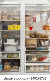 Closeup Of Open Refrigerator With Food Items In Commercial Kitchen