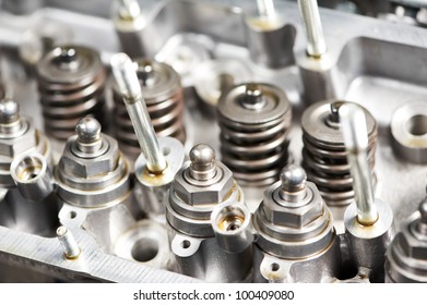 Close-up of opened automobile engine cylinder head for maintenance repair at car service station