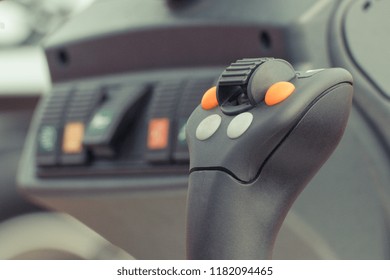 Closeup of operating control panel with buttons in truck, agricultural or industrial machine or other vehicle