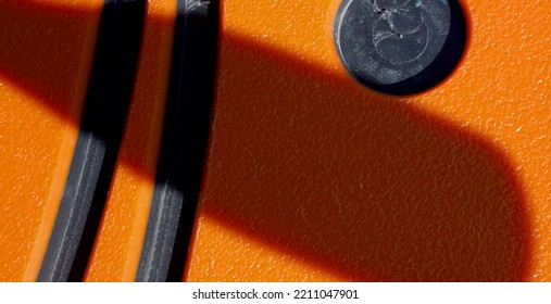 Close-up Orange And Black Plastic Texture Background