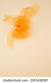 A Closeup Of Orange Organza Ribbon