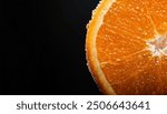 A close-up of an orange slice, showcasing the juicy, vibrant orange flesh covered in tiny water droplets. Blurred background, highlighting the freshness and detail of the fruit.