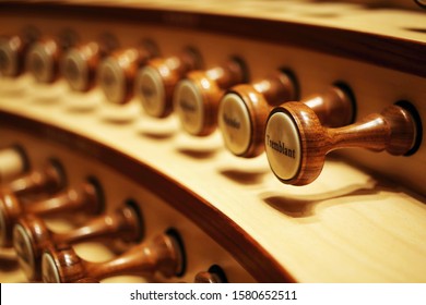 Closeup of organ knobs used for changing the voice of pipe organ sound. (very selective focus of depth)