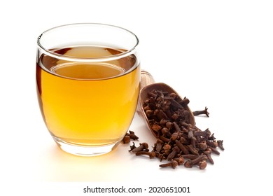 Close-Up Of Organic Boiled Water (Tea Or Kada ) Of  Clove (syzygium Aromaticum ) In A Transparent Glass Cup Over White Background. Original Residue In Bottom Of Tea Cup