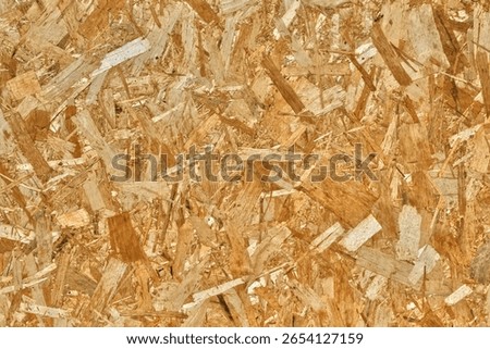 Close-up of oriented strand board surface with textured wood fragments, ideal for construction, DIY projects, and industrial design.