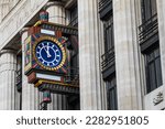 Close-up of an ornate art deco clock, on the exterior of Peterborough Court on Fleet Street in London, UK.