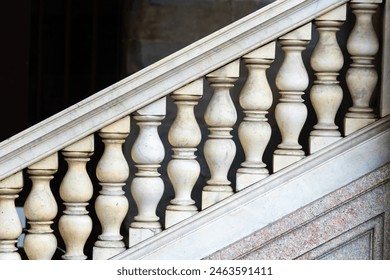 closeup of ornate stone staircase balusters with classic design, showcasing craftsmanship - Powered by Shutterstock