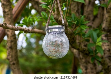 Closeup Of An Outdoor Chandelier Decorated With Broken Glass