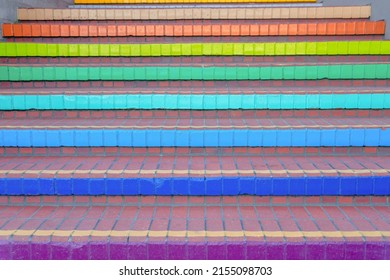 Close-up of an outdoor stairs with bricks and colorful risers in San Francisco, CA