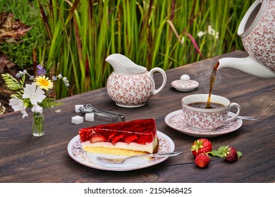 A Closeup Of The Outdoor Tea Table With A Piece Of Strawberry Jello Cake 