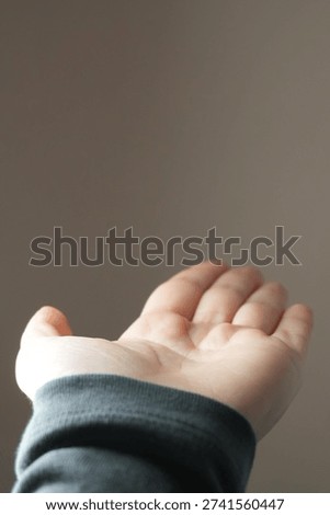 A close-up of an outstretched empty hand 