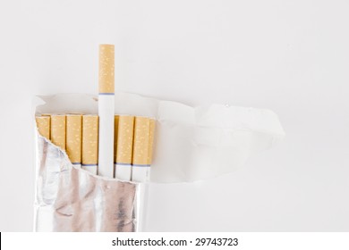 Closeup of pack of cigarettes on white background - Powered by Shutterstock