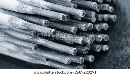 A close-up of a pack of welding electrodes