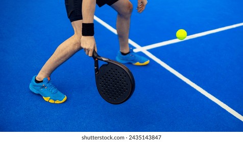 Close-up padel photo. Open Tour template. Padel tennis player on the blue court background outdoors. Paddle tenis template for bookmaker design ads with copy space. Mockup for betting advertisement. - Powered by Shutterstock