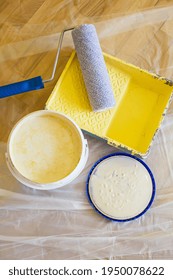 Close-up of paint roller while working indoors, renovation work