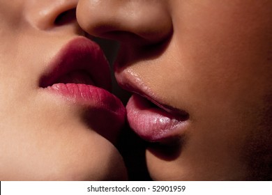 Closeup Of Pair Girls Mouths Kissing