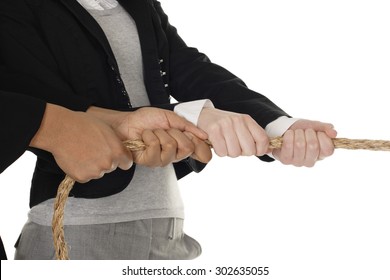 Close-up of a pair of hands pulling on a rope. - Powered by Shutterstock