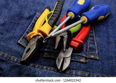 closeup pair of pliers screwdriver work tool electrician dark background - Shutterstock ID 1264021942