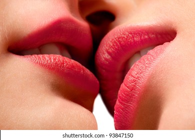 Closeup Of Pair Women Mouths Kissing