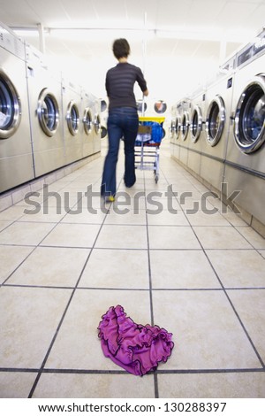 Closeup Of Panties Left On The Floor In Self Service Laundry Closeup Of Panties Left On The Floor In Self Service Laundry