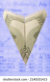 Close-up Of A Paper Airplane Made From A One Hundred Dollar Bill