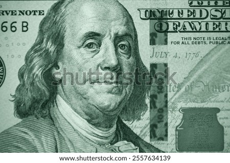Close-up of part of a hundred dollar bill. Fragment of old 100 dollar bill