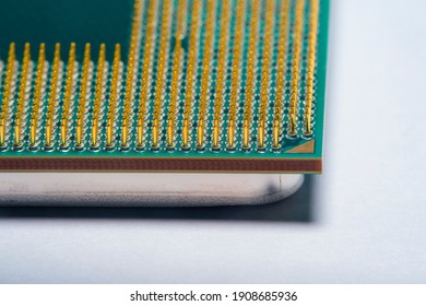 Close-up of a part of a microprocessor in soft focus under high magnification. Details of a computer component under a microscope on a light background