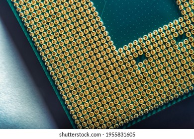 Close-up of a part of a microprocessor in soft focus under high magnification. Details of a computer component under a microscope on a light background