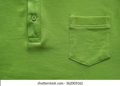 Closeup Part Of A Shirt From Cotton Fabric Of Green Color With A Big Pocket And A Fastener With The Button