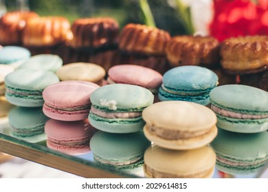 Close-up of pastel color macaroons or macarons  on a mirror surface. Birthday dessert. Sweets for the candy bar. Festive sweets. French confectionery. - Powered by Shutterstock