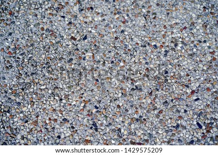 Closeup pathways pebble or epoxy stone flooring background