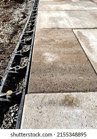 Closeup Of Paver Edging On A New Pathway At A Residential Construction Site.