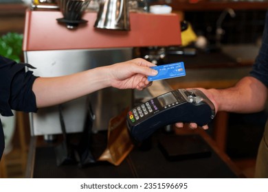 Close-up payment terminal handed out by employee customer make payment, by credit card tapping is credit card payment, for customers who are unable pay with cash, facilitate customers.	
 - Powered by Shutterstock