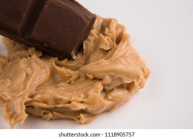 Closeup Of A Peanut Butter And Chocolate Bar Over White Background