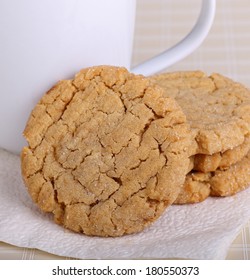 Closeup Of Peanut Butter Cookies With A Coffee Cup On A Napkin