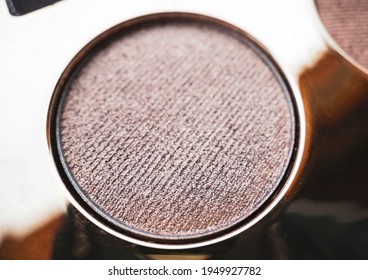 A Close-up Of Pearlescent Shimmery Gold Eyeshadow For Creating Eye Makeup.  Beauty Concept.