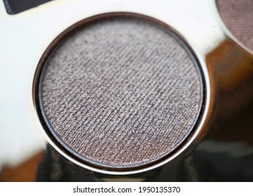 A Close-up Of Pearlescent Shimmery Gold Eyeshadow For Creating Eye Makeup.  Beauty Concept.